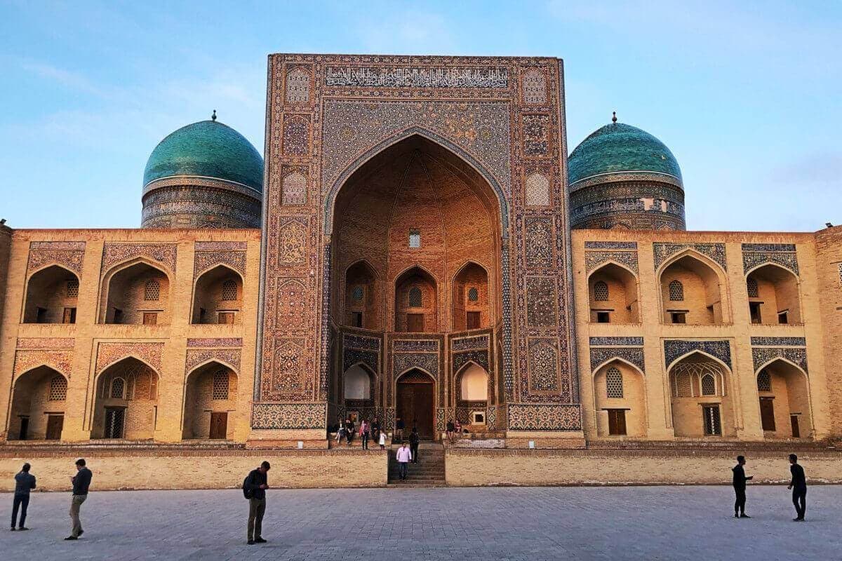 The front of the Mir-i-Arab Madrasa at dusk