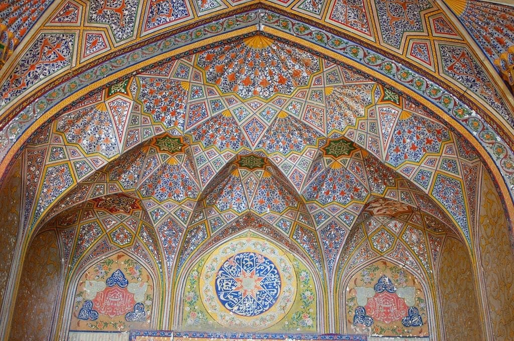 The painted muqarnas ceiling inside the entrance