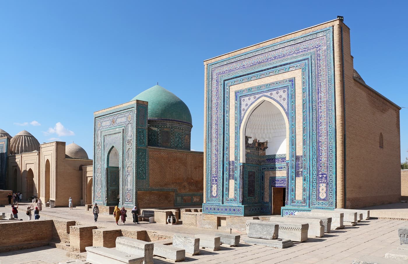 Two tiled mausoleum portals facing the lane in Shah-i-Zinda